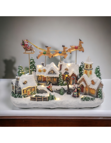 Villaggio di Natale Innevato con Chiesa 34x23cm, Babbo Natale su Slitta Volante, Renne in Movimento